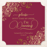 Posavasos De Papel Borgoña y oro no se lleven mi bebida Boda<br><div class="desc">¡Esta montaña rusa boda es elegante, elegante y divertida! Presenta un hermoso diseño de color burdeos y dorado con letras de escritura modernas y delicados rizos dorados y remolinos en las esquinas. El texto dice "Por favor, no tomen mi bebida, estoy bailando" con espacio para los nombres de la pareja...</div>