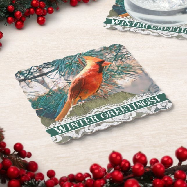 Posavasos De Papel Cardenal frente del invierno de los pinos (This paper coaster for your winter gathering features a beautiful red bird against a pine tree.)