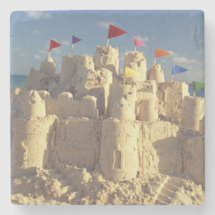 Posavasos De Piedra Castillo de arena en la playa