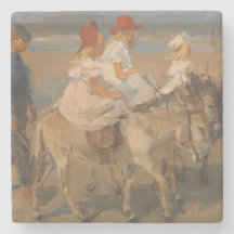 Chicas montando burros en la playa