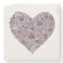 Corazón de cojín con flores púrpuras