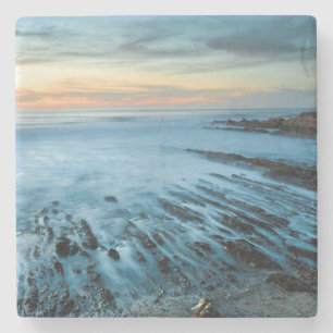 Posavasos De Piedra Paisaje marino azul al atardecer, California