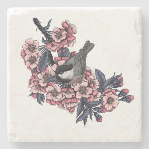 Posavasos De Piedra Pollo en una rama de cerezo floreciente