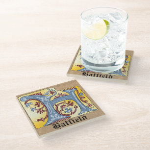Posavasos De Vidrio Letra medieval azul y marfil rojo iluminada H