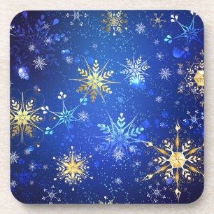 Posavasos Fondo azul XMAS con copos de nieve dorados