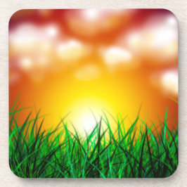 Posavasos Hermoso amanecer sobre un campo de hierba