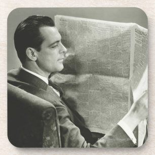 Posavasos Hombre de negocios que lee el periódico