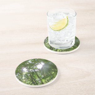 Posavasos Luz solar a través de la selva tropical con cubier