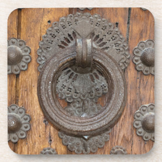 Posavasos Metal Knocker on Old Wooden Door