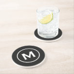 Posavasos Modern Black Classic Monogram Stone<br><div class="desc">Minimal monogrammed design features a black background with your initial in classic block typography in white for a clean,  simple stylish look.</div>
