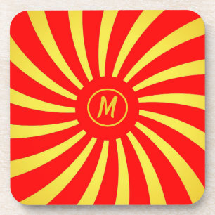 Posavasos Monograma dorado y espirales rojas