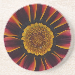 Posavasos Monstruo de flores rojas y amarillas