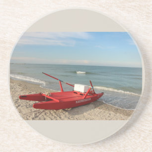Posavasos Pattino rosso sulla spiaggia - fotografía de mar