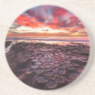 Posavasos Puesta de sol asombrosa en las piscinas de marea