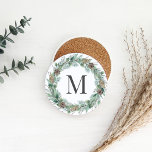 Posavasos Rustic Winter Greenery Monogram Initial Wreath<br><div class="desc">Elegant holiday sandstone stone beverage coaster design features a rustic chic wreath of winter watercolor greenery framing a family / last name monogram initial. Includes a white background color.</div>