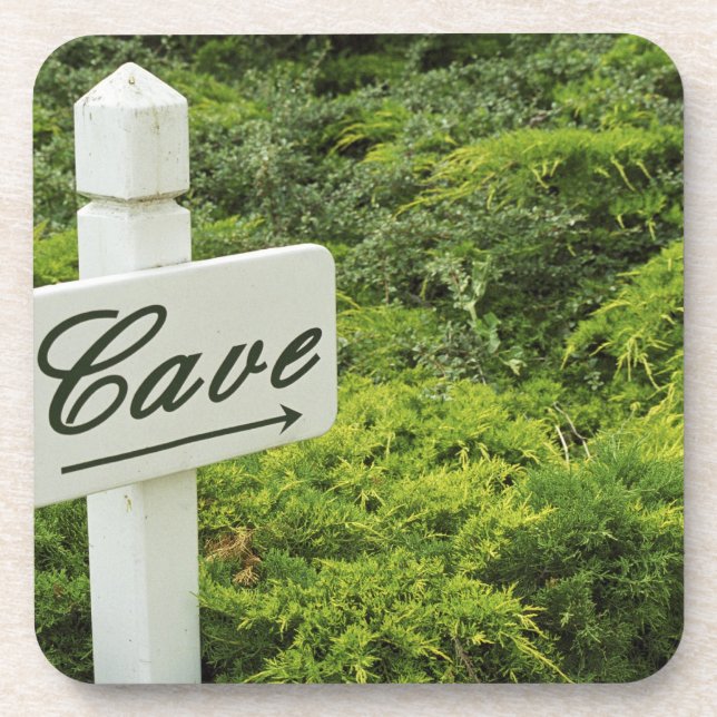 Posavasos Un cartel que señala a la bodega (cueva) en (Frente)