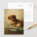 Postal A Dachshund Puppy | Carl Reichert<br><div class="desc">A Dachshund Puppy (1888) | Carl Reichert’s A Dachshund Puppy is a delightful portrait featuring a small brown dachshund puppy perched on a wooden stool. The artwork captures the puppy’s curious and innocent expression with exquisite detail, from the soft texture of its fur to the subtle shading of its surroundings....</div>