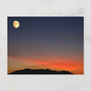 Postal Alcance lunar sobre el atardecer