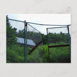 Postal An abandoned house beyond the broken fence.
