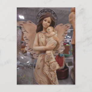 Postal Angel Holding Infant