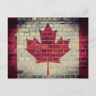 Postal Bandera de Canadá antigua en una pared de ladrillo