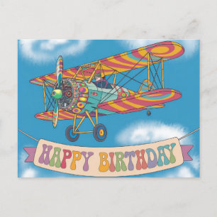 Postal Biplano volando sobre un banner de feliz cumpleaño