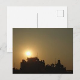Postal Black against the golden glow of the setting sun.