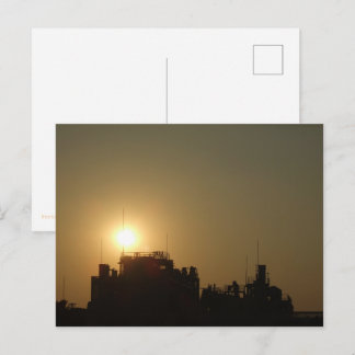 Postal Black against the golden glow of the setting sun.
