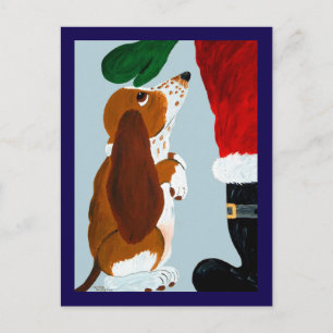 Postal Cachorro Basset recibiendo una mascota de Santa