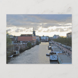 Postal Canal de Ámsterdam y molino de viento con puesta d