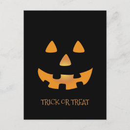 Postal Cara de calabaza de Halloween en fondo negro