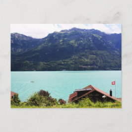 Postal Casa suiza con bandera