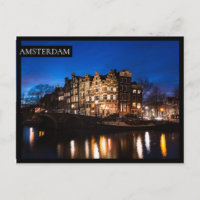 Casas de los canales de Amsterdam por la noche