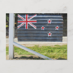 Postal cerca de la bandera de Nueva Zelanda
