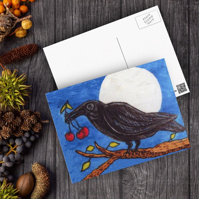 Postal Cerezas de Cuervo Negro Claro de Luna (Black crow on branch holding cherries full moon blue night sky on postcard.)