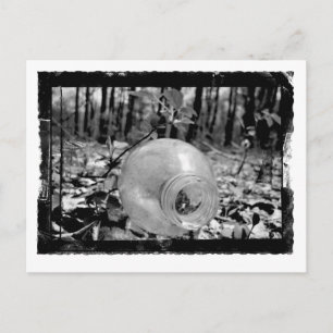 Postal con botella de tierra