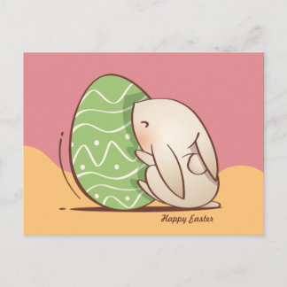 Postal Conejo lindo empujando Huevo verde de Pascua