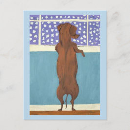 Postal Dachshund en la ventana viendo nevar
