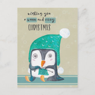 Postal del navidad del pingüino que hace punto