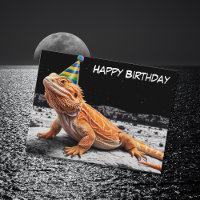 Dragón barbudo con sombrero de cumpleaños