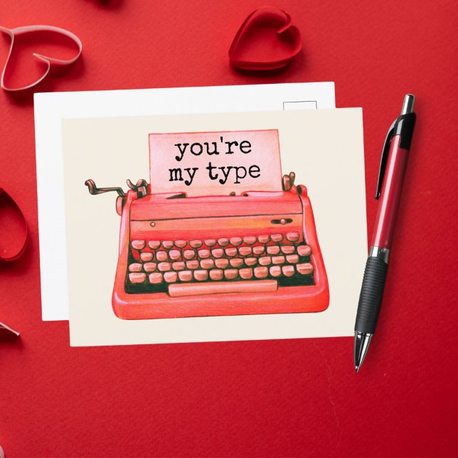 Postal Eres mi tipo de novela roja nostálgica (Against a vintage ivory background, this red typewriter is typing a Valentine's message.)