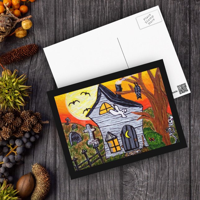 Postal Escena de la casa embrujada por el arte popular de (Haunted house with cemetery full moon ghost and bats with black border on postcard for Halloween.)