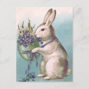 Postal Festiva Conejo de Pascua sosteniendo huevo de colores
