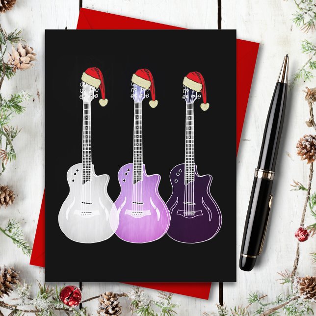 Postal Festiva Guitars de navidades con sombreros de Papá Noel ro (Christmas guitars wearing santa hats pop art on black budget holiday postcard for guitarist musician)