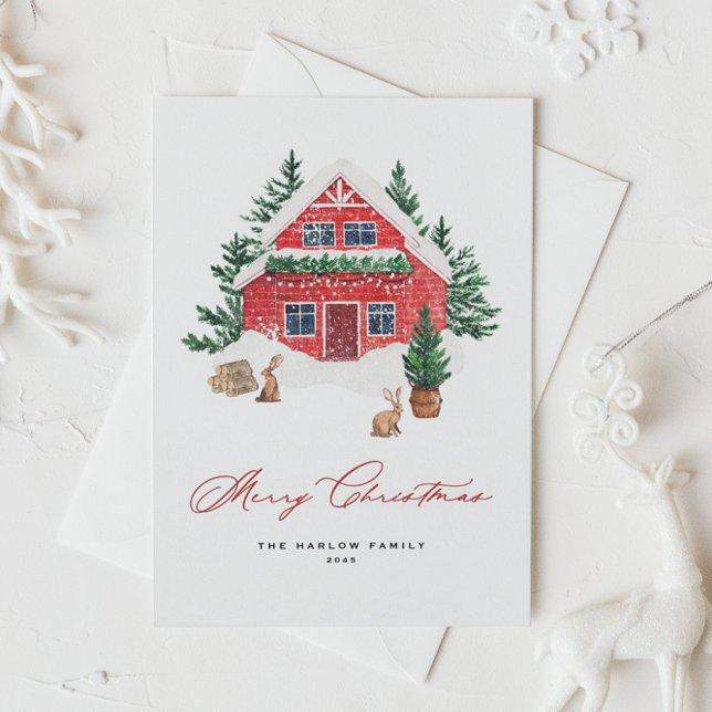 Postal Festiva Navidades de madera de color de nieve rojo de algo (Watercolor Christmas postcard featuring watercolor red cottage with rabbits and evergreen trees.)