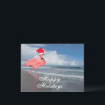 Postal Festiva Navidades rosados de Flamingo Beach Felices Fiesta<br><div class="desc">Los Navidades de la playa de Flamingo rosado se alegran con el saludo de postales de vacaciones. La tarjeta de bienvenida perfecta para Navidades al estilo de Florida con un flamingo vestido con un gorra de Santa Claus en la costa atlántica mirando la marea.</div>