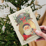 Postal Festiva Old Fashioned Retro Christmas Santa Claus Amela<br><div class="desc">This Vintage Old Fashioned Themed Retro Christmas Winter Santa Claus with Amela and Frame in Beige, Green and Red colors Holiday Postcard with old typing lettering "A Merry Christmas" will be perfect for your gift ideas this holiday greeting season. On back side you can customize wishes with your own and...</div>