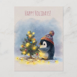 Postal Festiva Small penguin decorates tiny Christmas tree,
