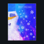 Postal Festiva Snowman brilla con Navidades Blue Magic<br><div class="desc">Hermosa postal de Navidades de snowman invernal y copos de nieve. Feliz deseo de Navidad para tus amigos y familia - puedes cambiar el texto. Los copos de nieve blancos sobre fondo abstracto azul y rosa hacen que esta postal sea mágica y de cuento de hadas.</div>