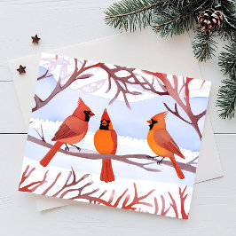 Postal Festiva Tres cardenales rojos en ramas nevadas